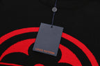 Black T-shirt with red logo graphic and hanging tag