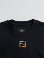 Fendi crew-neck T-shirt close-up with FENDI logo patch at neckline