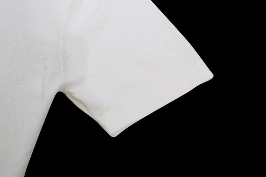 White T-shirt sleeve and shoulder seam, smooth cotton fabric