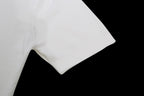 White T-shirt sleeve and shoulder seam, smooth cotton fabric