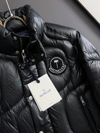 Moncler long puffer jacket, black with circular logo patch and hanging tags