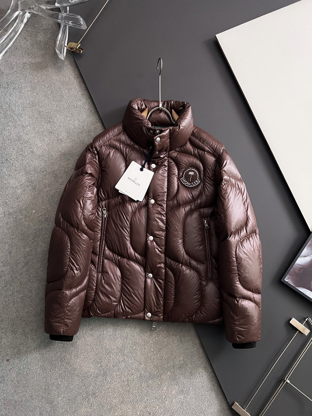 Moncler long puffer jacket in dark brown, full zip, stand collar, snap buttons