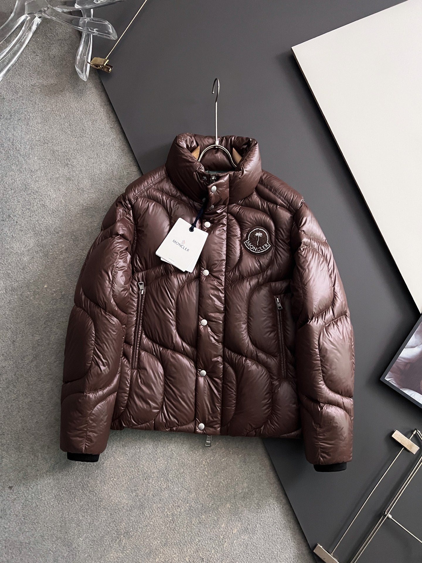 Moncler long puffer jacket in dark brown, full zip, stand collar, snap buttons
