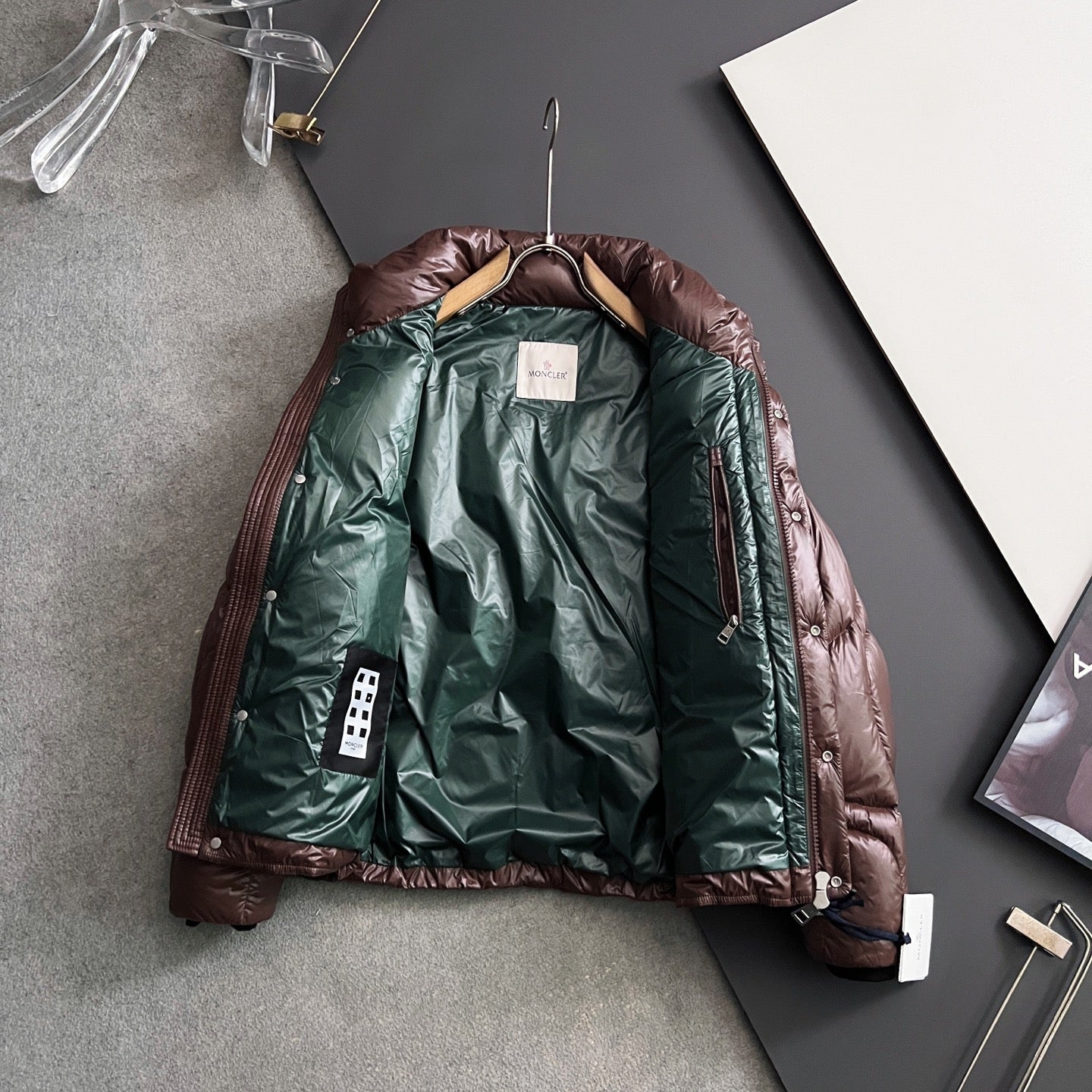 Moncler puffer jacket with dark brown outer and green lining, front zipper, hang tag
