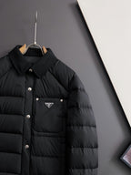 Prada long black puffer jacket with chest pocket and triangle logo badge
