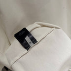 White T-shirt with inner black brand label on stitched collar
