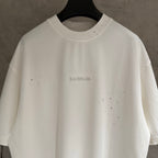 Balenciaga white short-sleeve T-shirt with centered rhinestone logo detail
