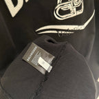 Black Balenciaga logo T-shirt fabric tag near neckline and emblem print