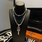 Silver-tone layered chain necklace with dagger charm pendant