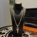 Silver-tone double-chain necklace with dagger-shaped pendant