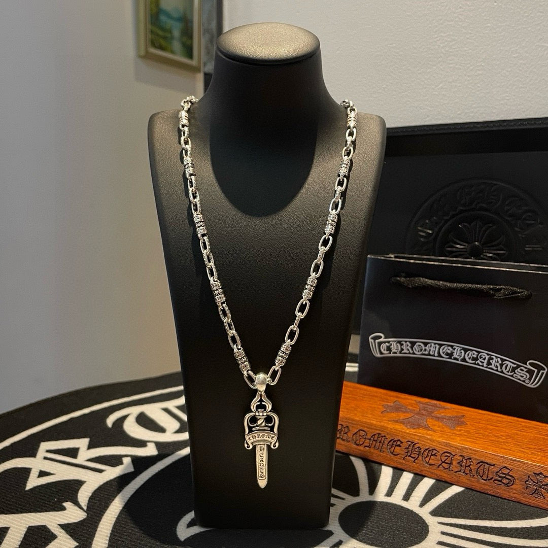 Silver-tone double-chain necklace with dagger-shaped pendant