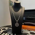 Silver chain necklace with round medallion pendant and small bead links