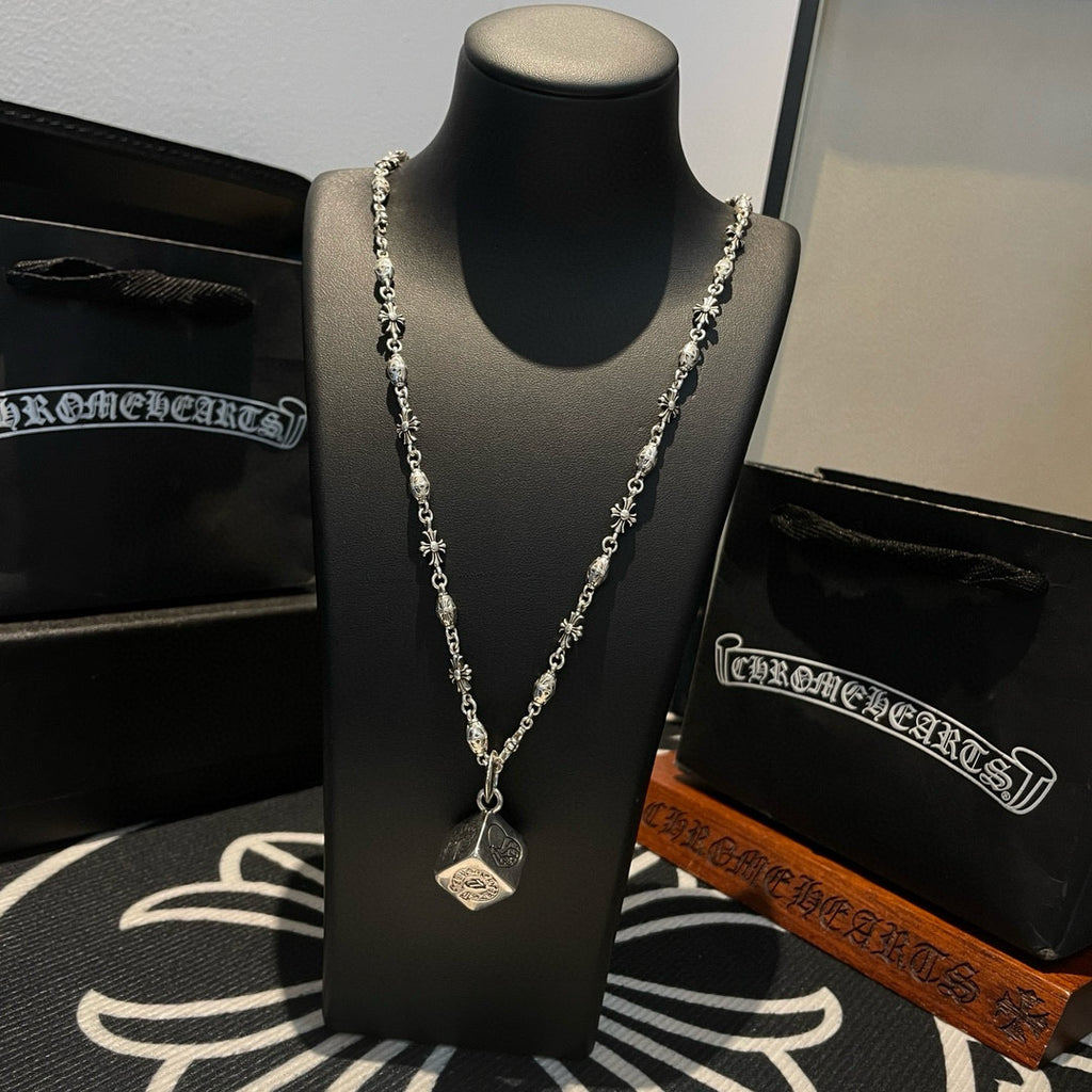 Silver chain necklace with square pendant on bust display, full chain view