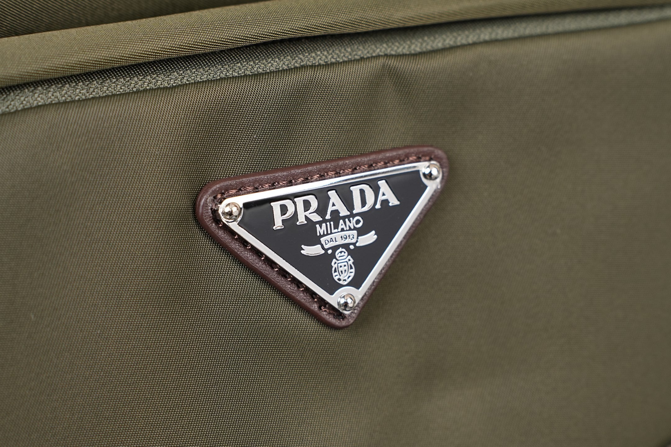 Prada Milano logo patch on olive fabric backpack