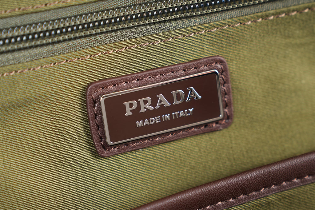 Prada Made in Italy label on olive fabric with brown trim