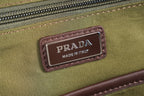 Prada Made in Italy label on olive fabric with brown trim