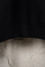 Black knit sweater fabric and ribbed hem