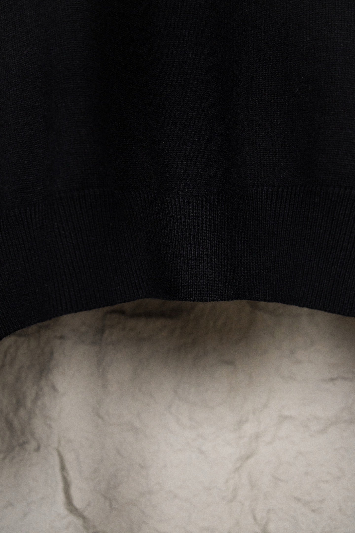 Black knit sweater fabric and ribbed hem
