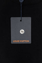 Black knit sweater hang tag with Louis Vuitton logo