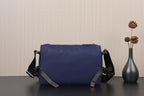 Dark blue Prada nylon crossbody bag with adjustable strap and front panel