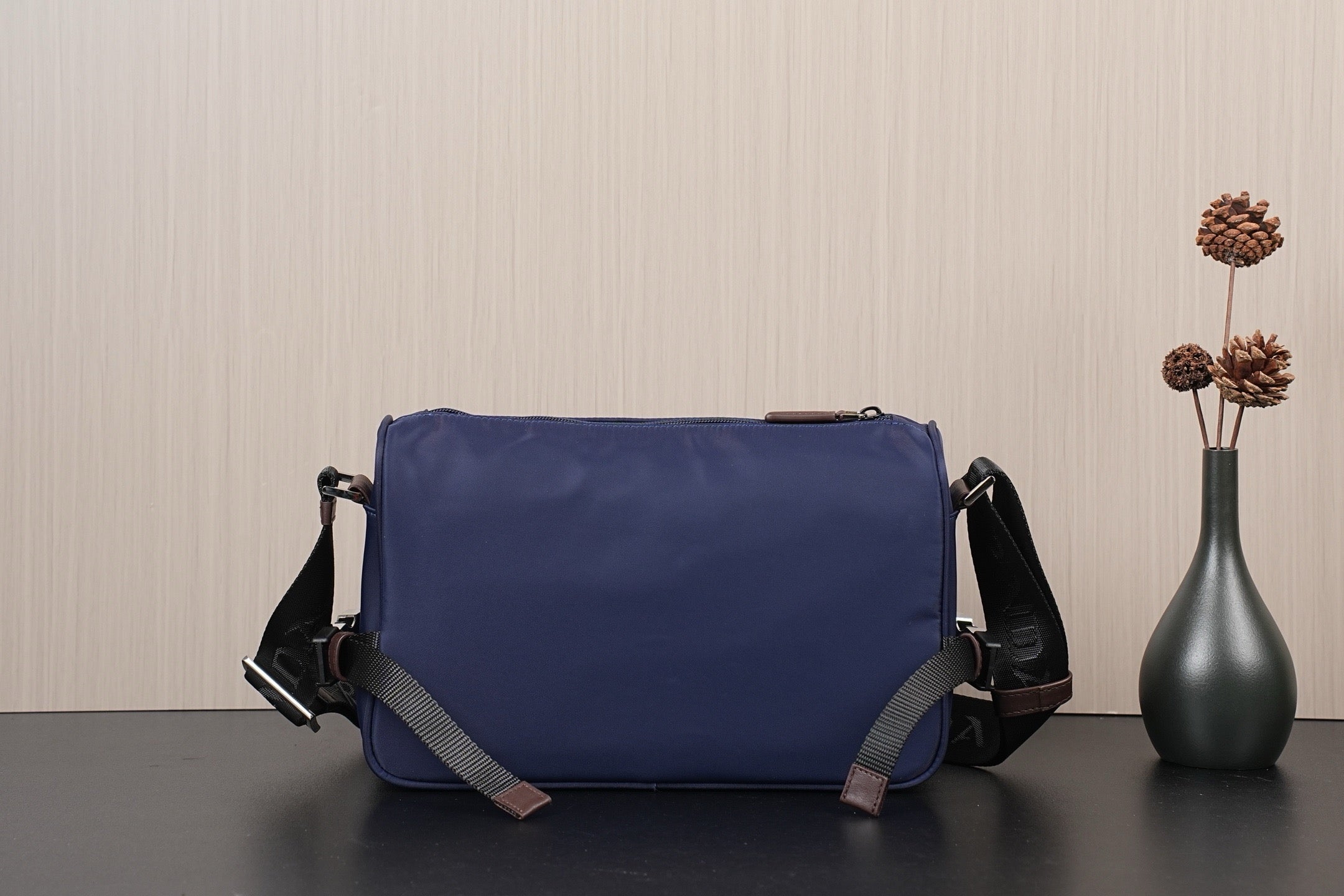 Dark blue Prada nylon crossbody bag with adjustable strap and front panel