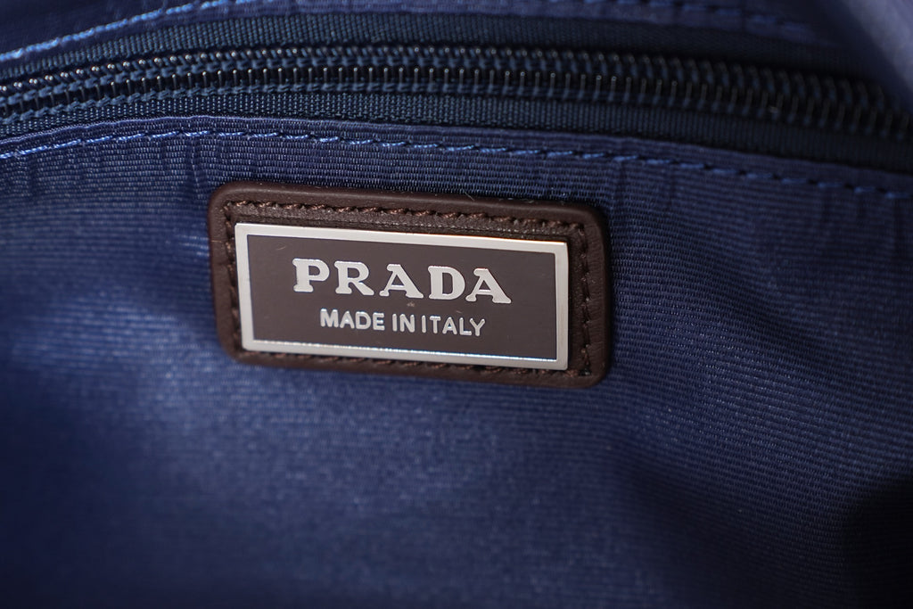 Prada Made in Italy leather label on blue zipper tape