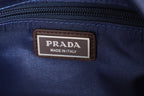 Prada Made in Italy leather label on blue zipper tape