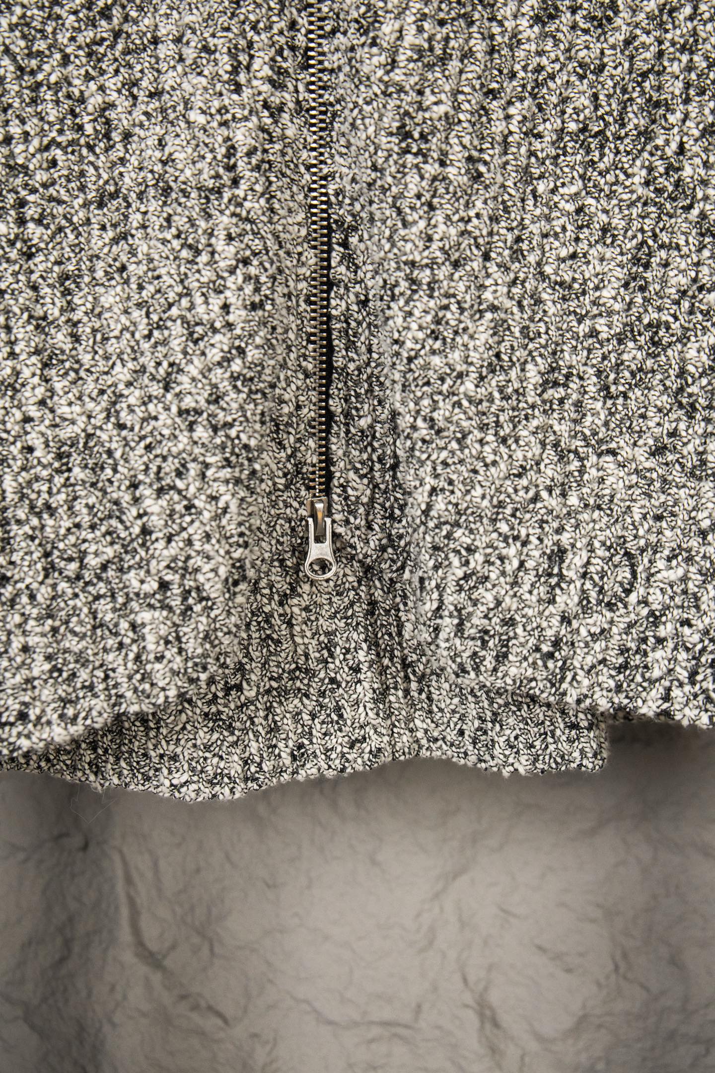Stone Island flecked jacket close-up, full zipper and textured knit surface
