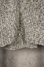 Speckled textured jacket front with full zipper and stand collar edge