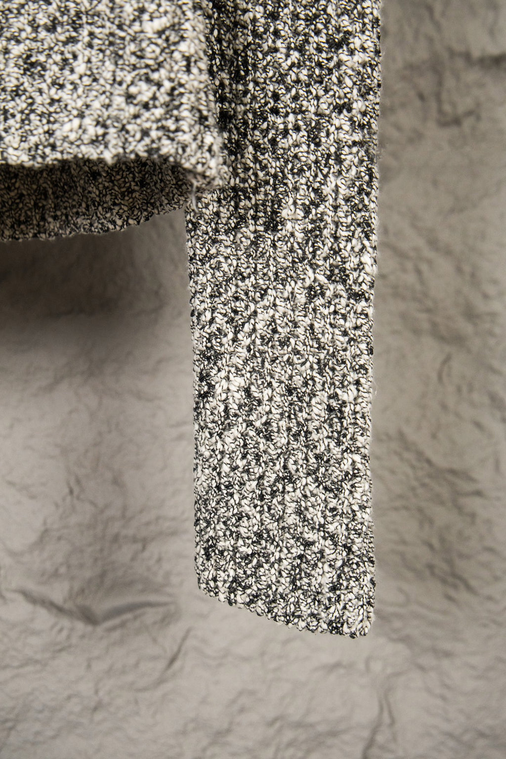 Stone Island flecked jacket hem view, textured black-and-white knit