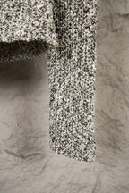 Stone Island flecked jacket hem view, textured black-and-white knit