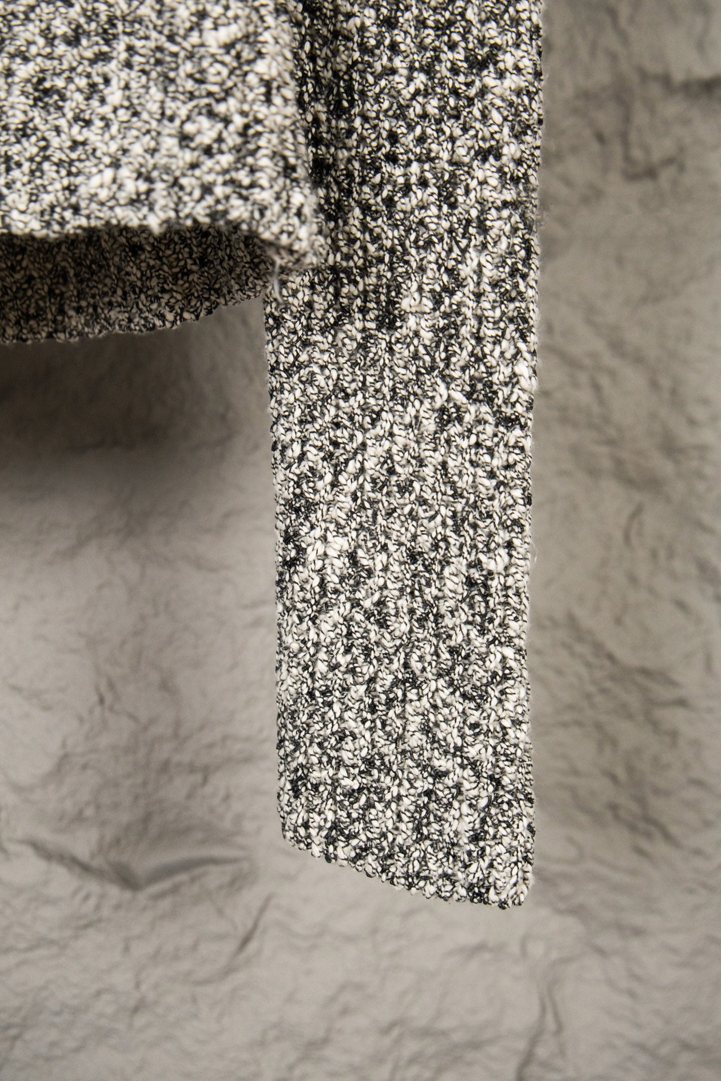 Stone Island flecked jacket hem view, textured black-and-white knit