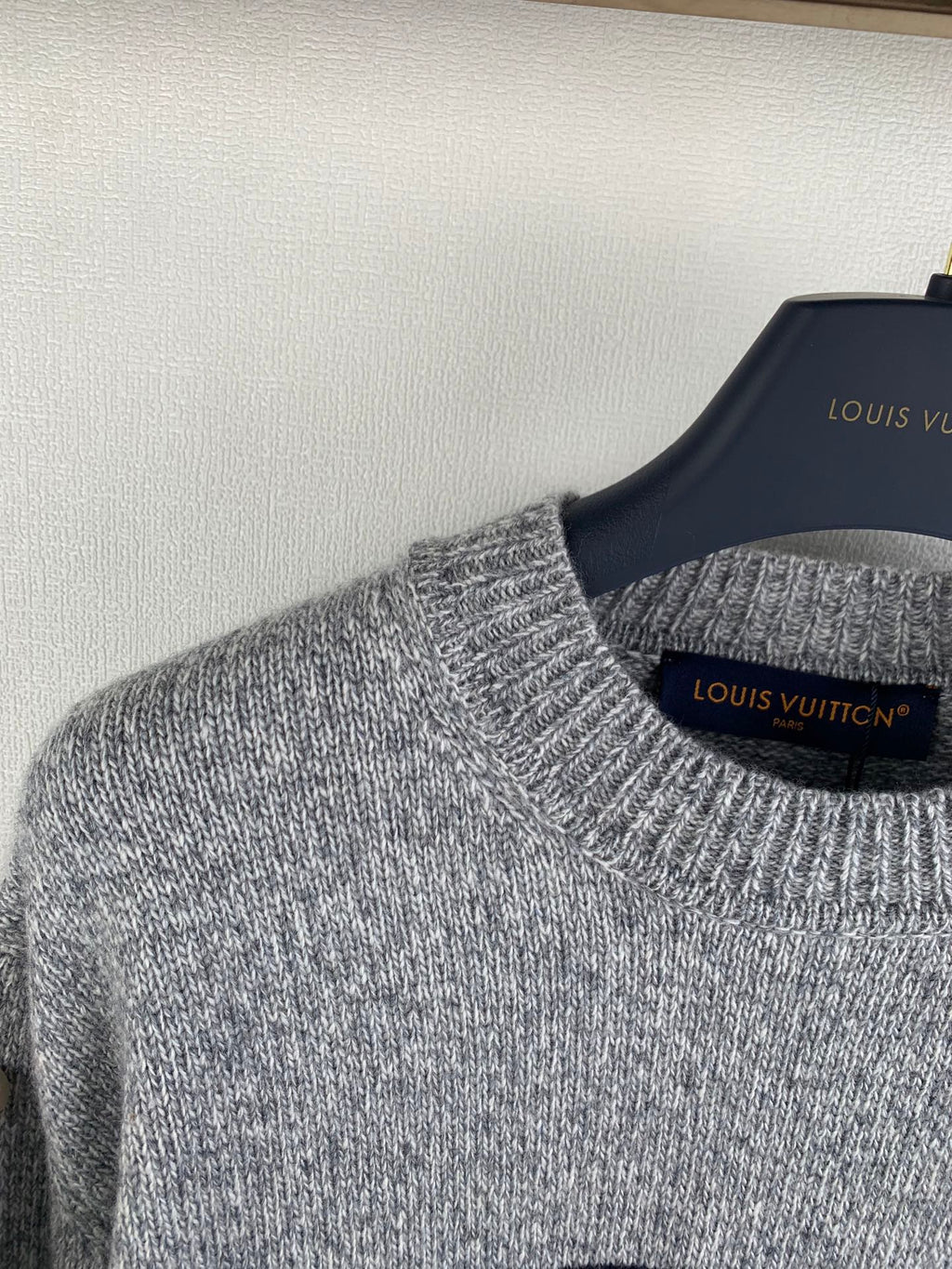 Grey crewneck knit sweater collar and ribbed knit cuffs