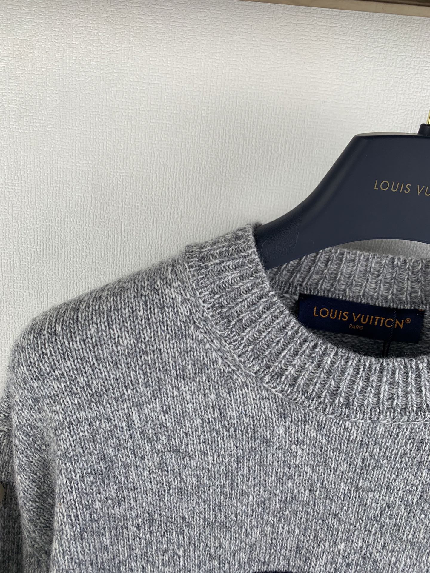 Grey crewneck knit sweater collar and ribbed knit cuffs