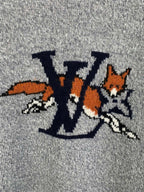 Grey knit sweater front graphic detail with LV-style letters and animals