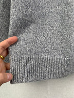 Grey knit sweater ribbed hem detail