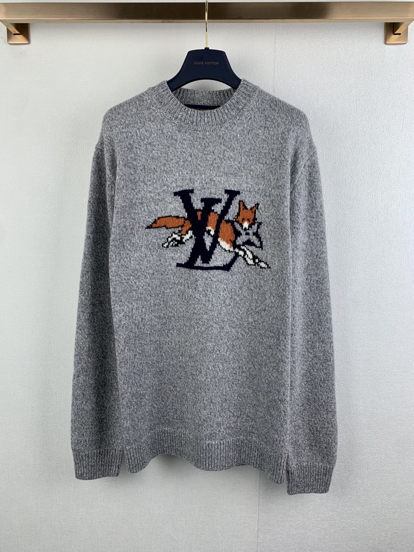 Grey long-sleeve knit sweater with large LV-style front graphic