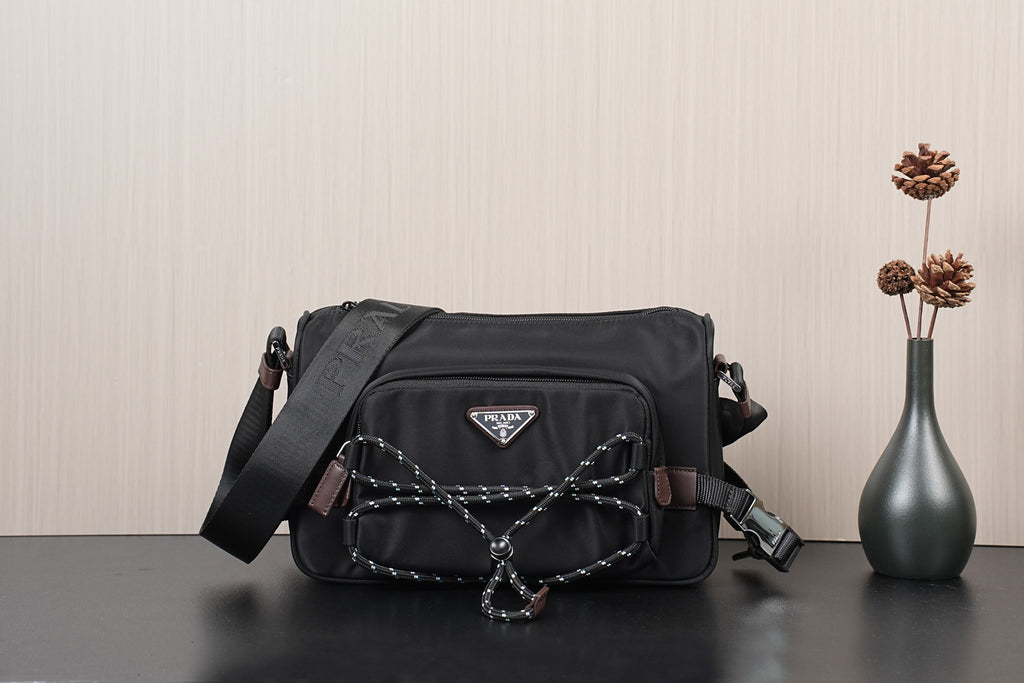 Black Prada crossbody bag with logo triangle and braided chain strap