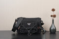 Black Prada crossbody bag with logo triangle and braided chain strap