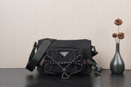 Black Prada crossbody bag with logo triangle and braided chain strap