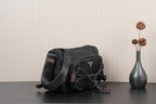 Black Prada crossbody bag with adjustable strap and chain detail