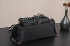 Black Prada bag with braided chain top handle and metal buckles