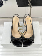 Dior black peep-toe heeled sandals with bow straps and stiletto heels