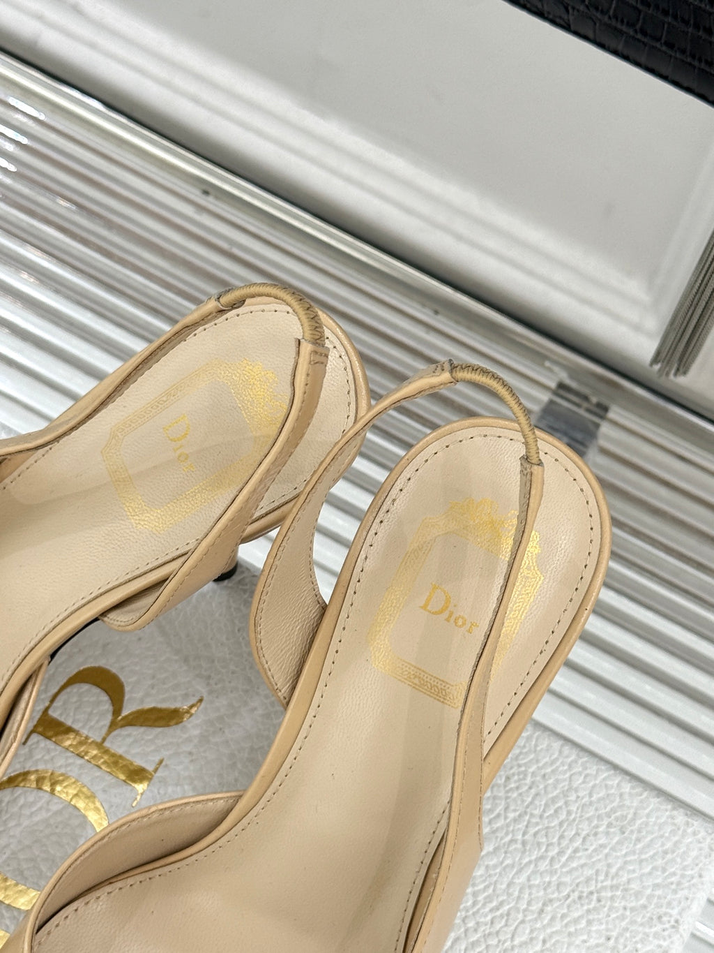 Beige slingback sandal heels with Dior logo on footbed