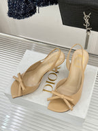 Beige open-toe heeled sandals with knot bow ankle strap and slingback