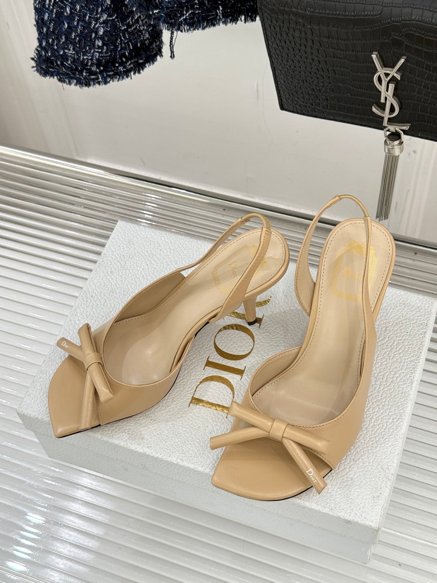 Beige open-toe heeled sandals with knot bow ankle strap and slingback