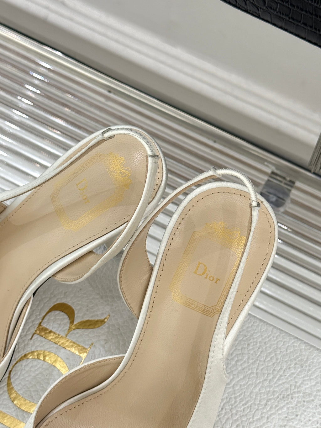 Dior ladies sandals close-up, white slingback with branded insole and trim