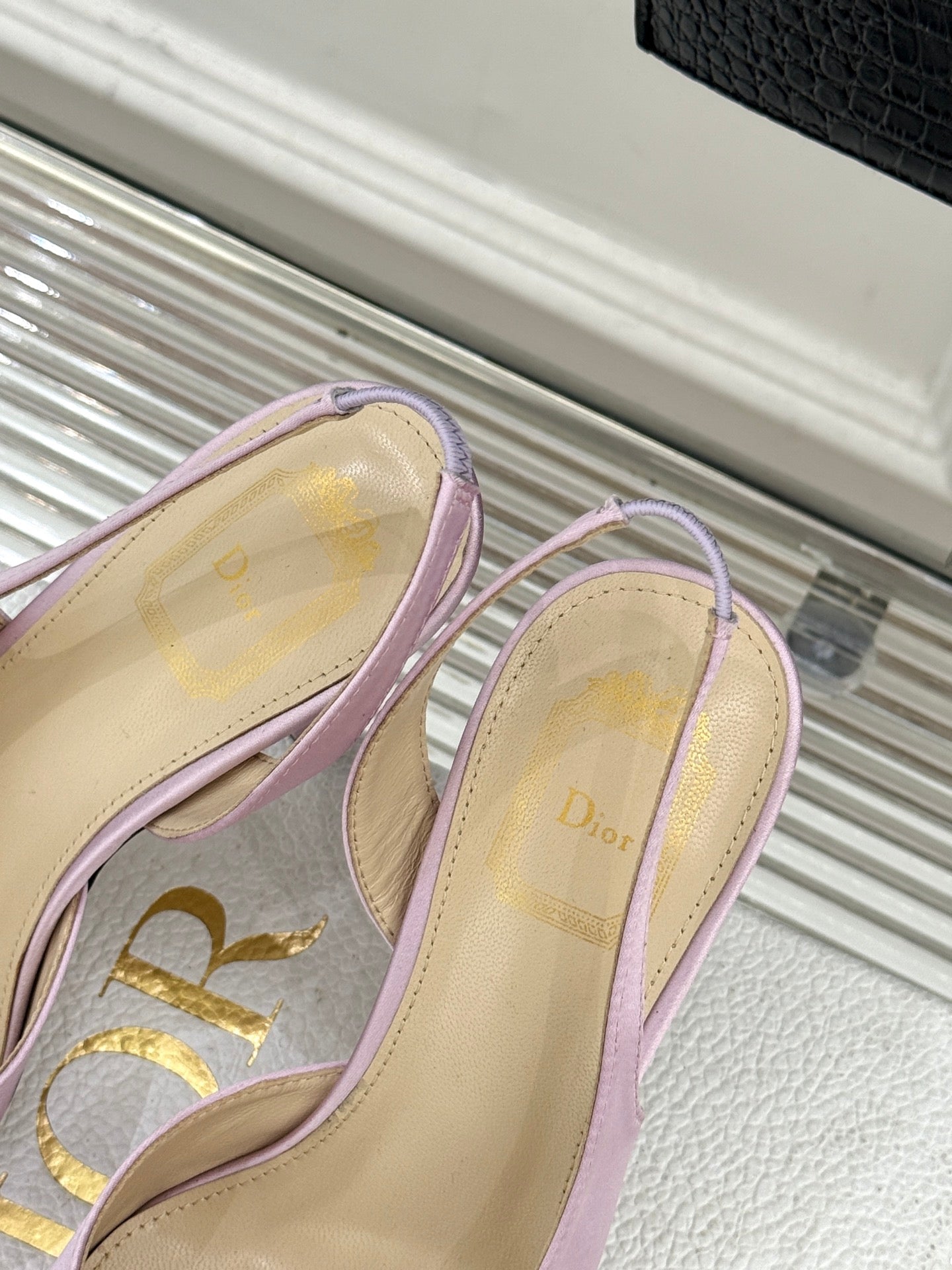 Lilac slingback pumps open-back view with Dior logo on lining