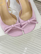 Lilac slingback pumps close-up of bow and Dior logo on insole