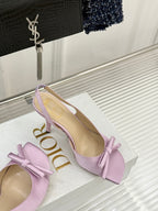 Lilac slingback pumps with bow strap and Dior logo, side view